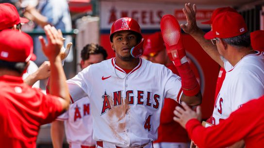 Christian Moore #4 of the Los Angeles Angels celebrates in the dugout during the game against the Boston Red Sox at Angel Stadium of Anaheim on June 25, 2025 in Anaheim, California. 