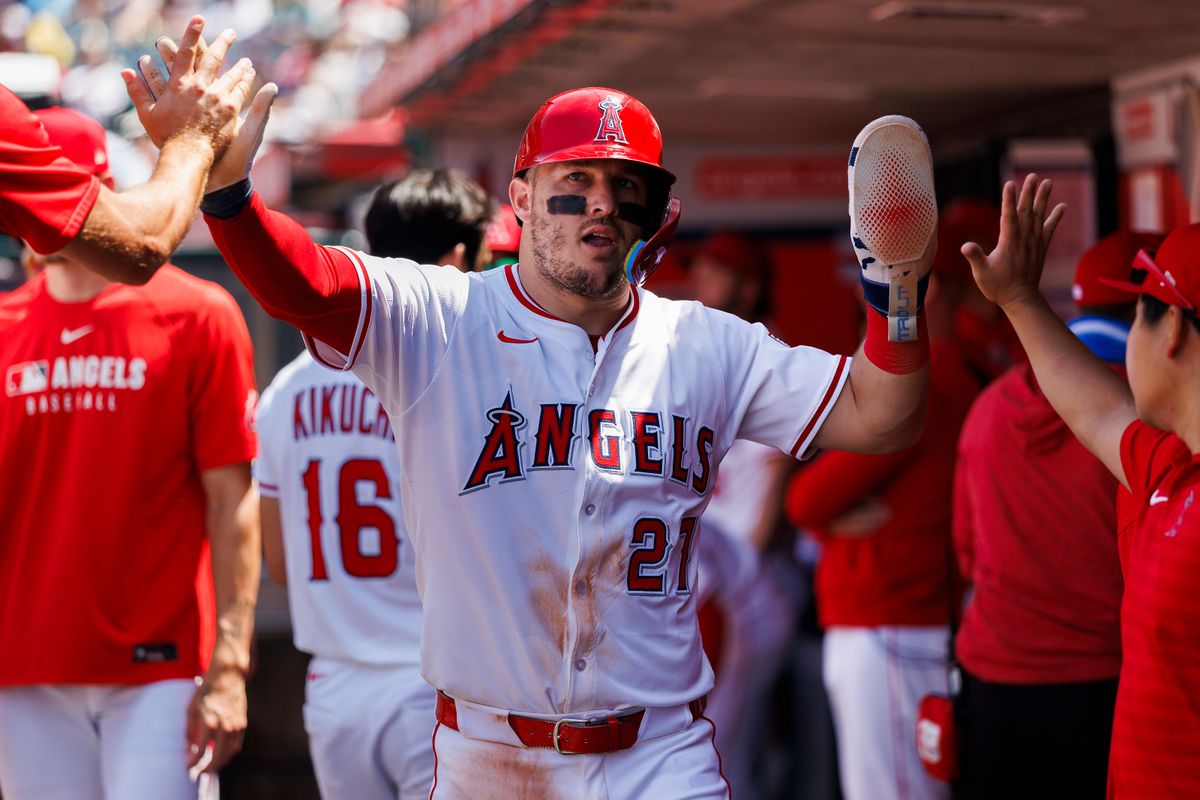 Mike Trout #27 of the Los Angeles Angels celebrates in the dugout during the game against the Boston Red Sox at Angel Stadium of Anaheim on June 25, 2025 in Anaheim, California. Mike Trout #27 of the Los Angeles Angels celebrates in the dugout during the game against the Boston Red Sox at Angel Stadium of Anaheim on June 25, 2025 in Anaheim, California.
