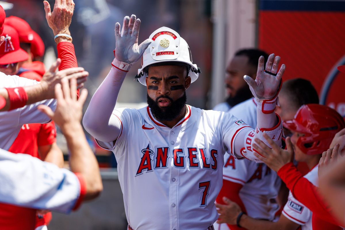 Jo Adell #7 of the Los Angeles Angels celebrates in the dugout during the game against the Boston Red Sox at Angel Stadium of Anaheim on June 25, 2025 in Anaheim, California. Jo Adell #7 of the Los Angeles Angels celebrates in the dugout during the game against the Boston Red Sox at Angel Stadium of Anaheim on June 25, 2025 in Anaheim, California.