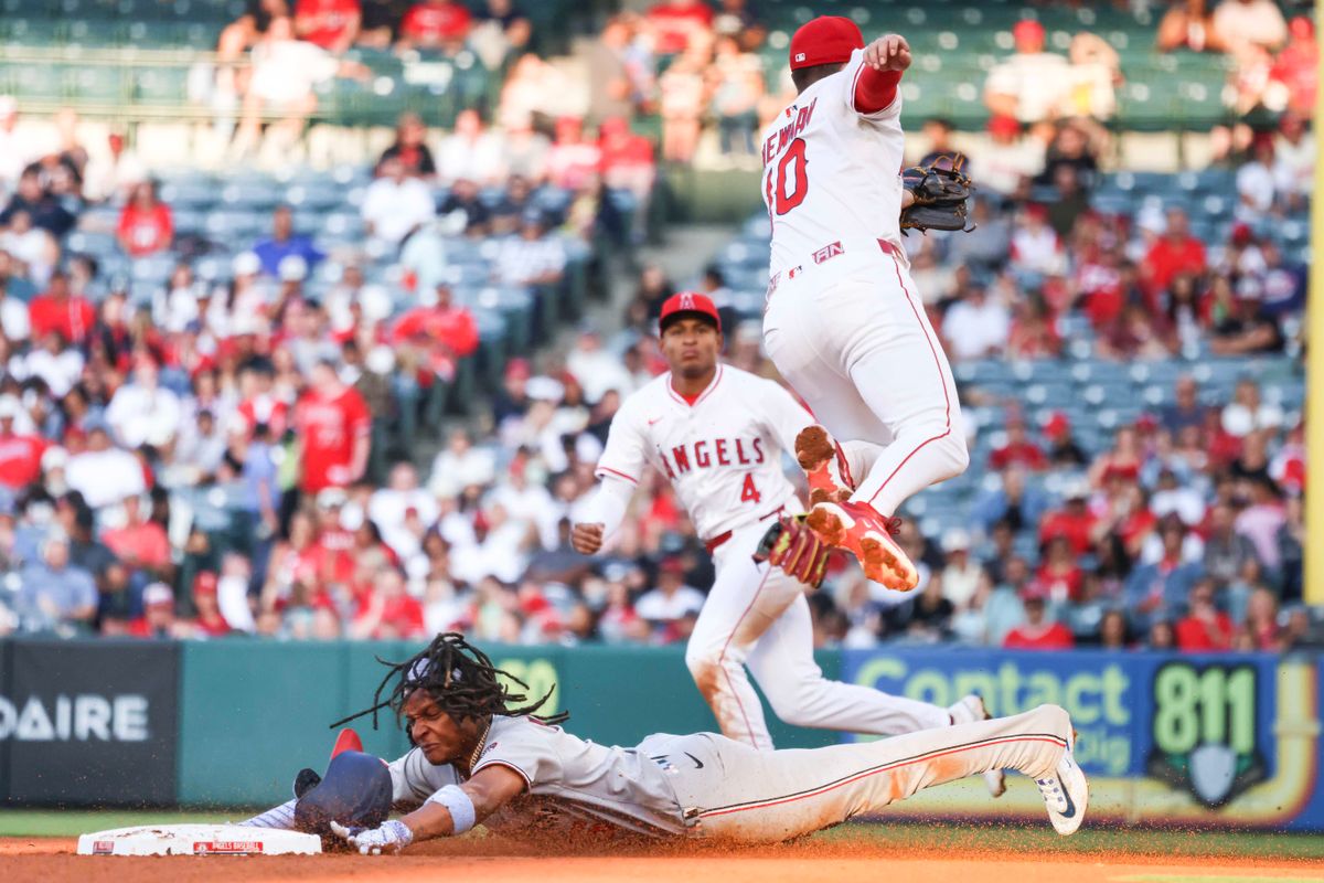 Los Angeles Angels infielder Kevin Newman (10) jumps over the runner in attempt to catch the ball during the MLB game against the Washington Nationals Friday June 27th, 2025 at Angel's Stadium in Anaheim, Calif. Los Angeles Angels infielder Kevin Newman (10) jumps over the runner in attempt to catch the ball during the MLB game against the Washington Nationals Friday June 27th, 2025 at Angel's Stadium in Anaheim, Calif.