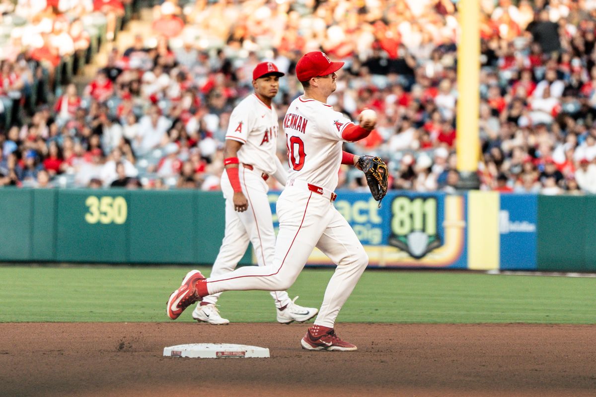 Los Angeles Angels IF Kevin Newman (10) throws out the runner at first in a game against the Washington Nationals Saturday June 28th, 2025 at Angel's Stadium in Anaheim, Calif.