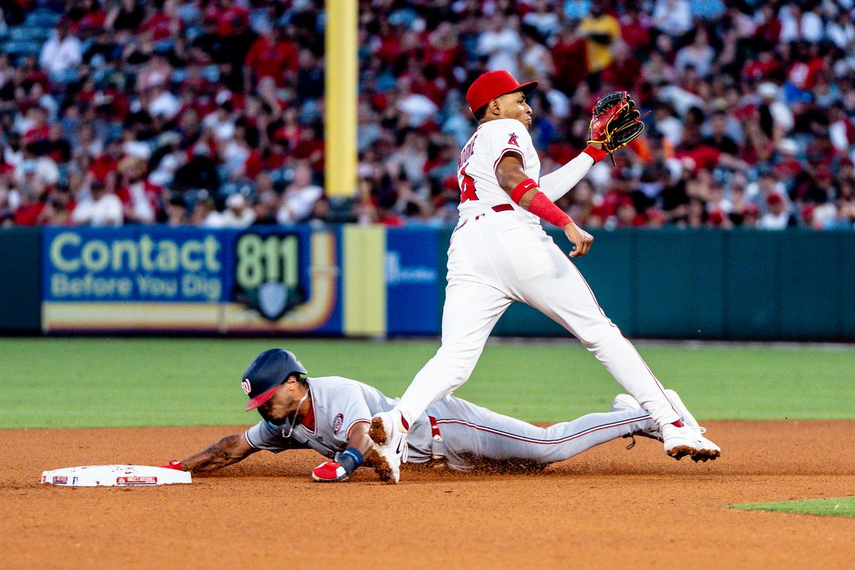 Los Angeles Angels IF Christian Moore (4) attempts to tag out the runner going to second base in a game against the Washington Nationals Saturday June 28th, 2025 at Angel's Stadium in Anaheim, Calif.