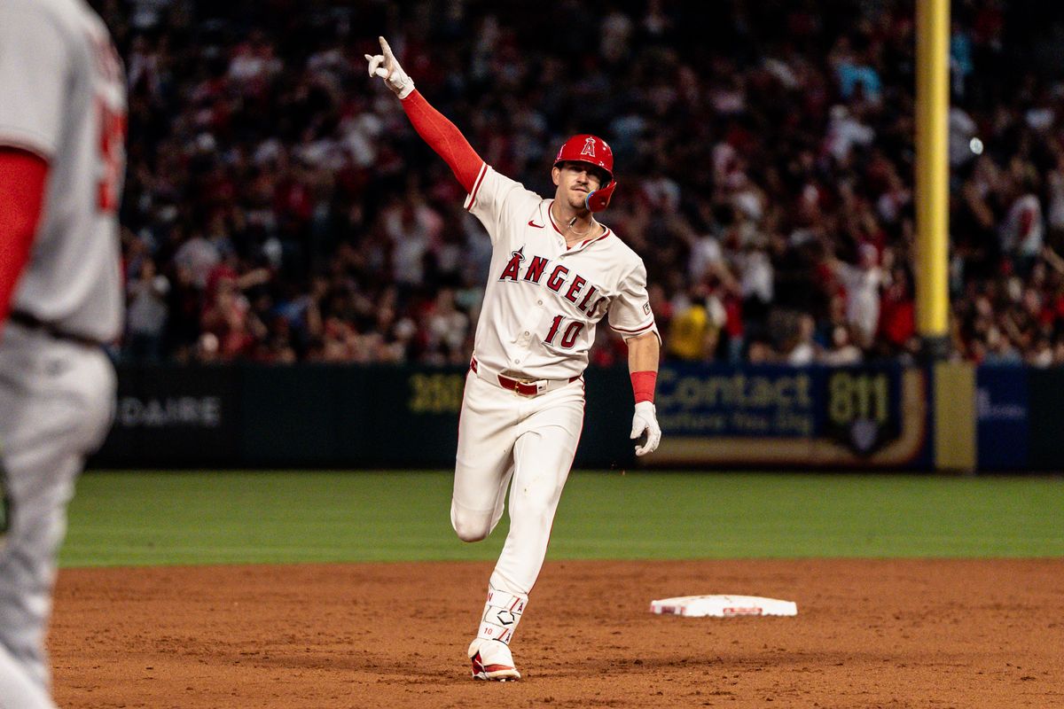 Los Angeles Angels IF Kevin Newman (10) rounds second base and pointing to the sky after hitting a home run in a game against the Washington Nationals Saturday June 28th, 2025 at Angel's Stadium in Anaheim, Calif.