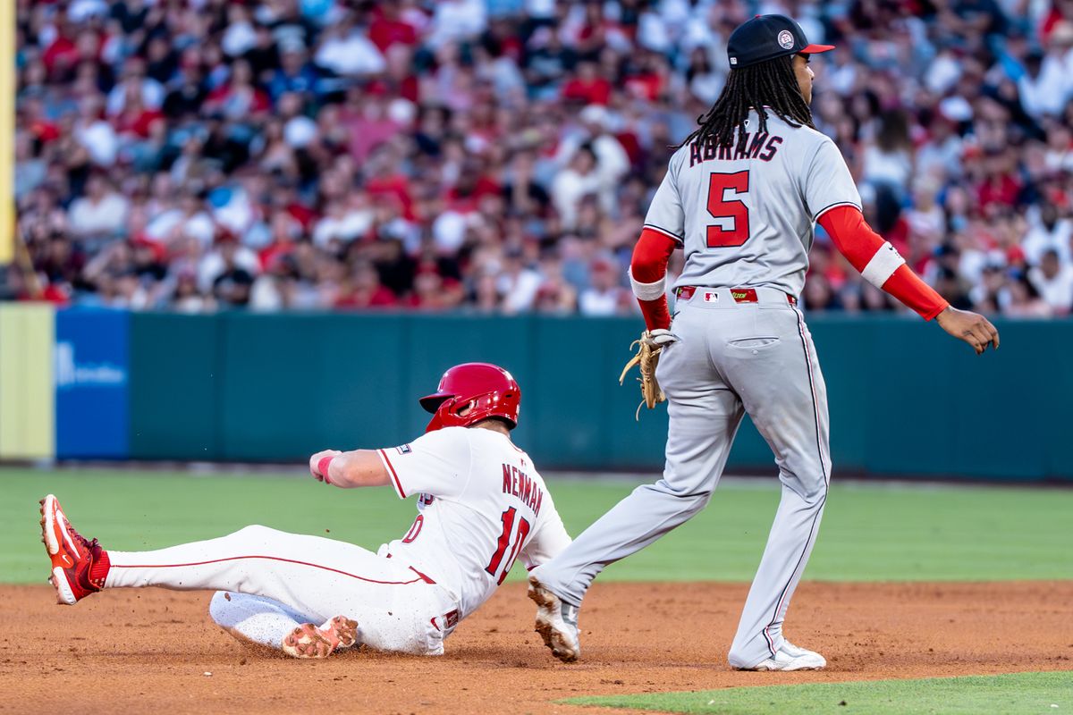 Los Angeles Angels IF Kevin Newman (10) slides to second base in a game against the Washington Nationals Saturday June 28th, 2025 at Angel's Stadium in Anaheim, Calif.