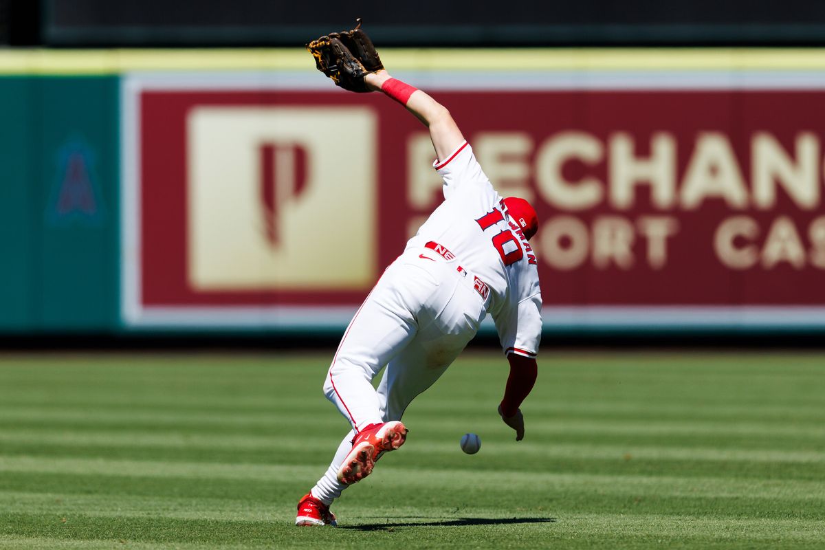 Kevin Newman #10 of the Los Angeles Angels drops the ball during the game against the Washington Nationals at Angel Stadium of Anaheim on June 29, 2025 in Anaheim, California. Kevin Newman #10 of the Los Angeles Angels drops the ball during the game against the Washington Nationals at Angel Stadium of Anaheim on June 29, 2025 in Anaheim, California.