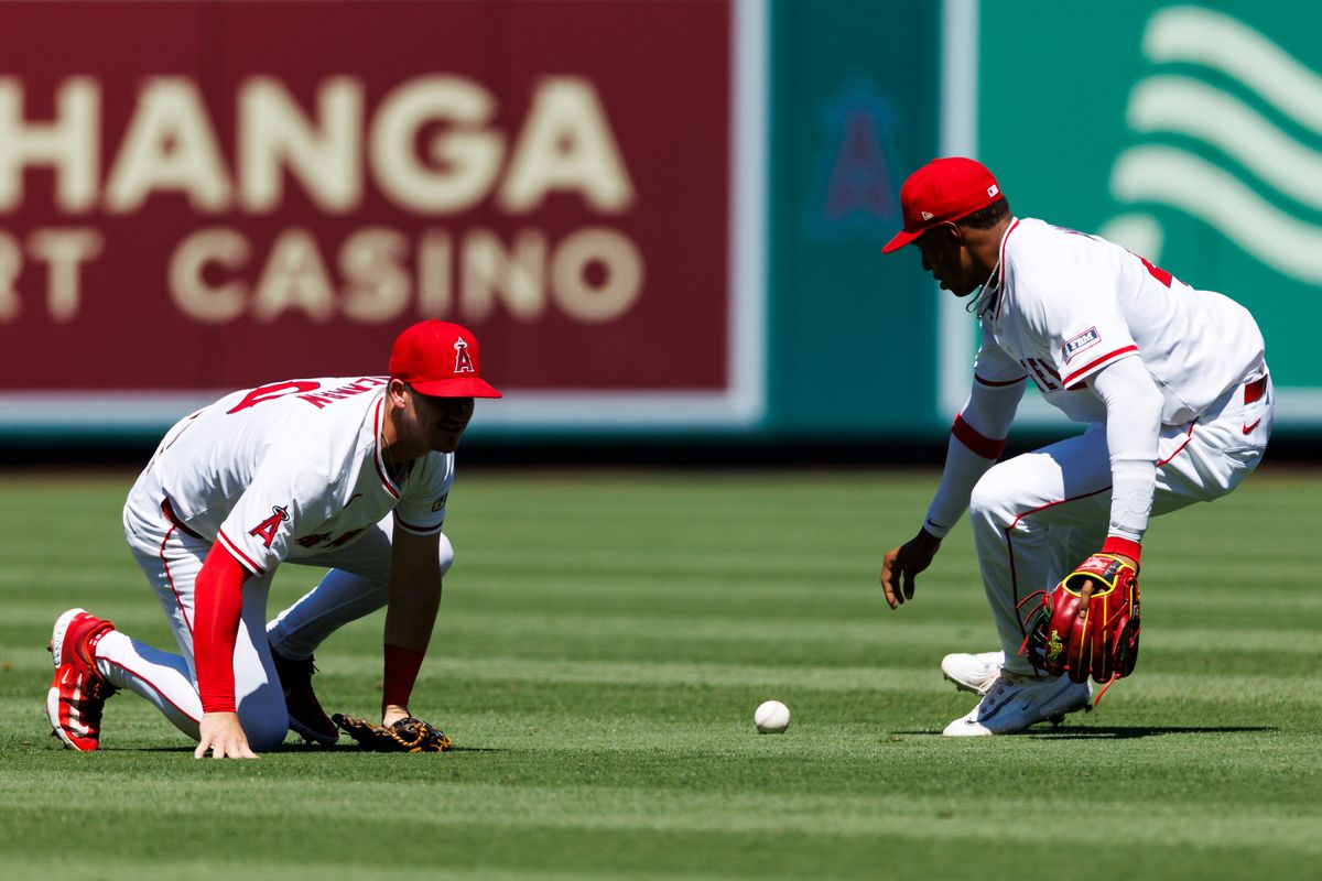 Kevin Newman #10 of the Los Angeles Angels drops the ball during the game against the Washington Nationals at Angel Stadium of Anaheim on June 29, 2025 in Anaheim, California. Kevin Newman #10 of the Los Angeles Angels drops the ball during the game against the Washington Nationals at Angel Stadium of Anaheim on June 29, 2025 in Anaheim, California.