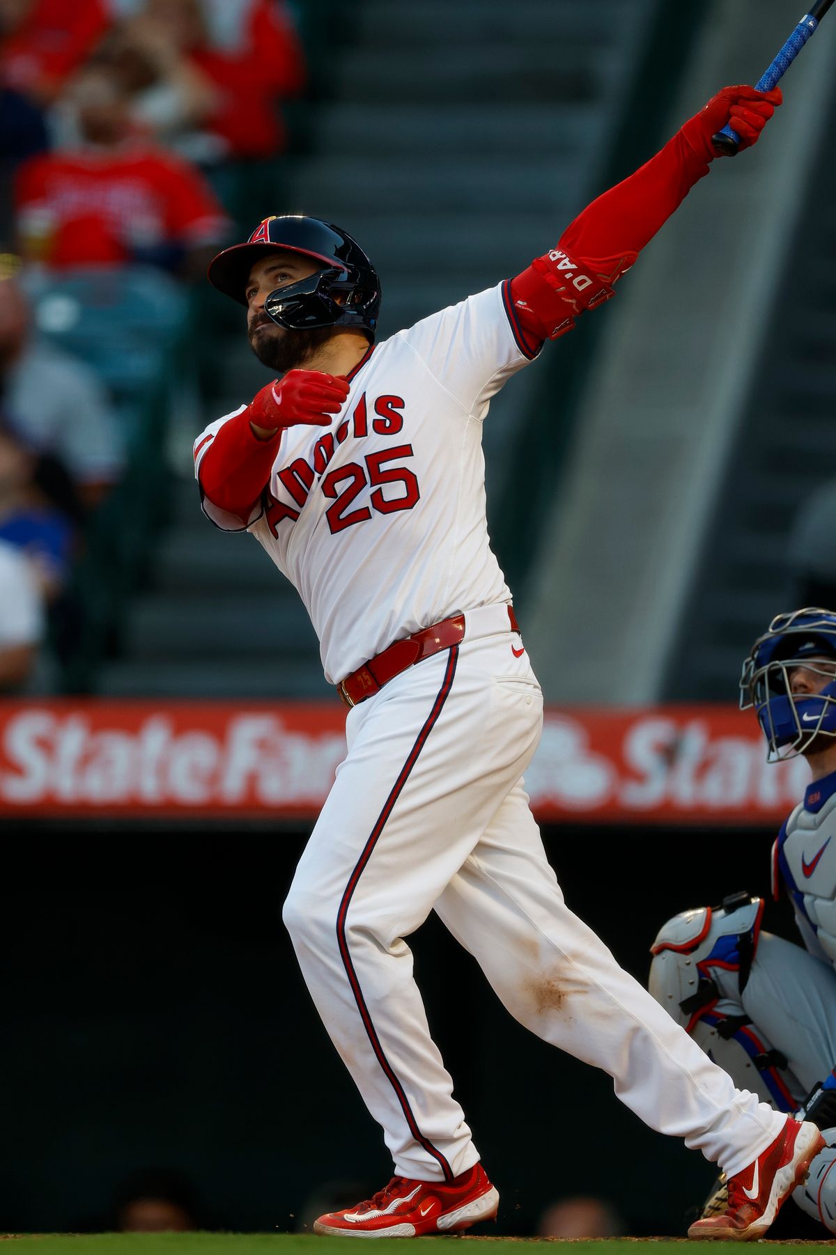 Travis d'Arnaud #25 hits a two-run home run during a game against the Texas Rangers at Angel Stadium on July 7, 2025, in Anaheim, California. Travis d'Arnaud #25 hits a two-run home run during a game against the Texas Rangers at Angel Stadium on July 7, 2025, in Anaheim, California.