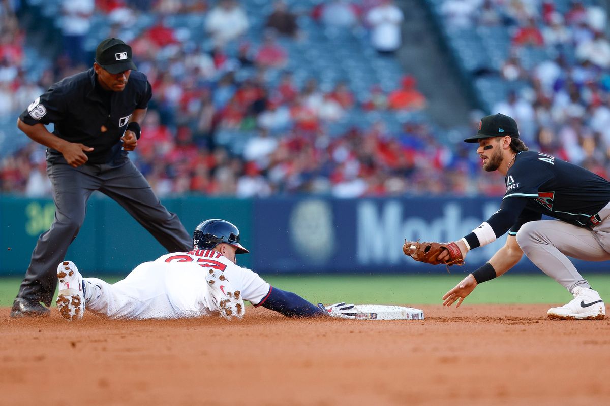 Mike Trout #27 of the Los Angeles Angels slides safely into second base on a double during a game against the Arizona Diamondbacks at Angel Stadium on July 11, 2025, in Anaheim, California.