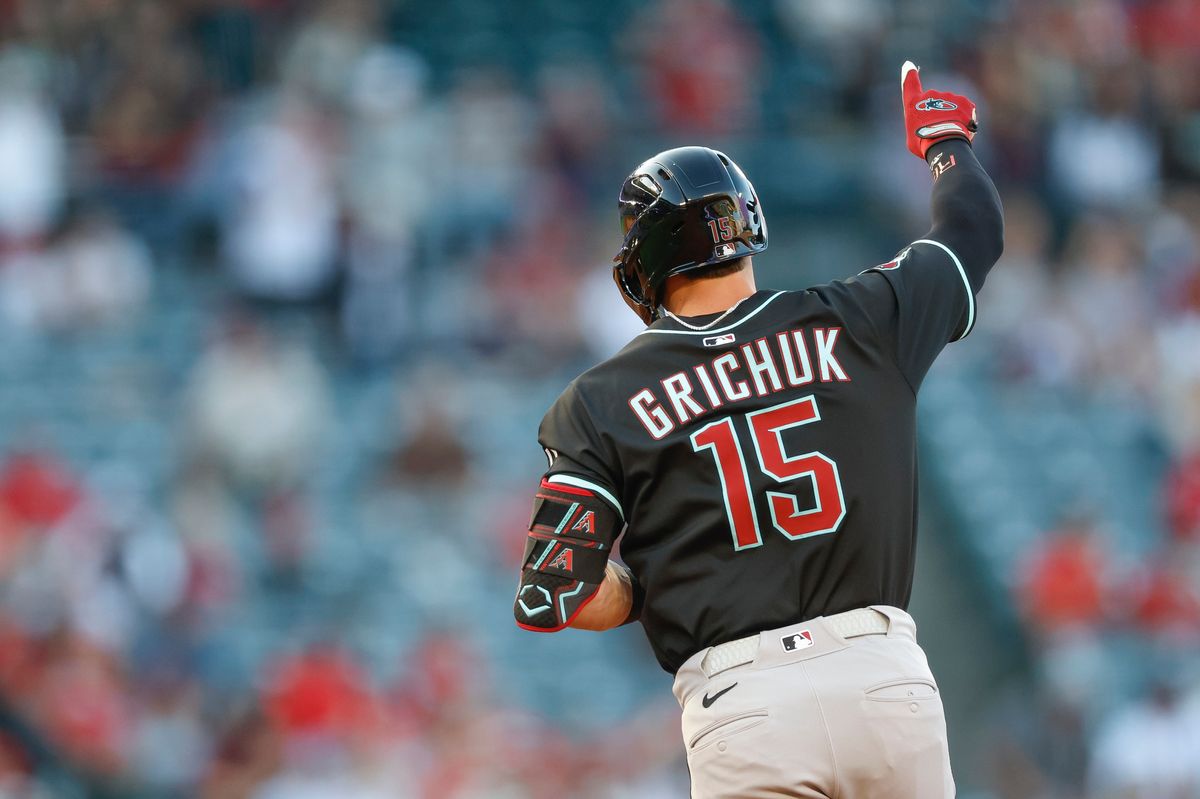 Randal Grichuk #15 of the Arizona Diamondbacks celebrates a home run during a game against the Los Angeles Angels at Angel Stadium on July 11, 2025, in Anaheim, California.