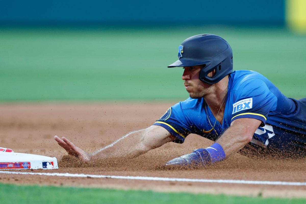 J.T. Realmuto #10 of the Philadelphia Phillies dives into third base during a game against the Los Angeles Angels at Citizens Bank Park on July 18, 2025, in Philadelphia, Pennsylvania. J.T. Realmuto #10 of the Philadelphia Phillies dives into third base during a game against the Los Angeles Angels at Citizens Bank Park on July 18, 2025, in Philadelphia, Pennsylvania.