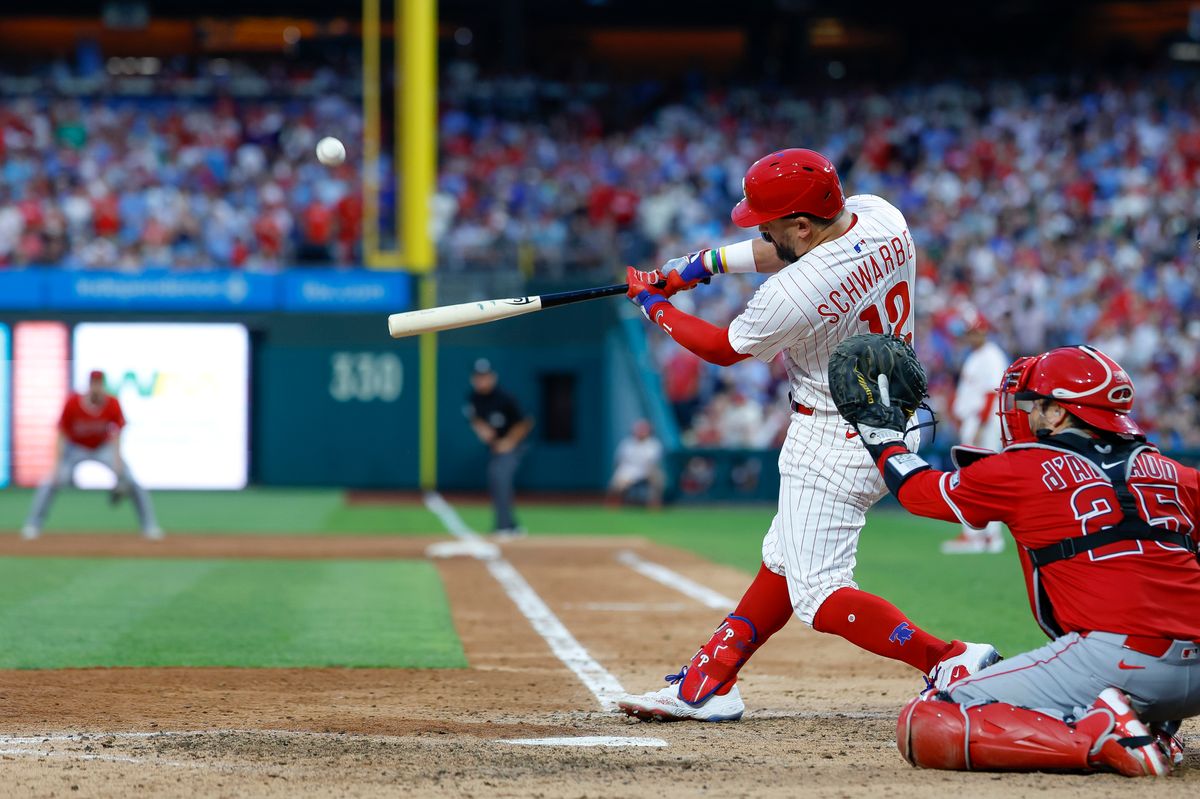 Kyle Schwarber #12 of the Philadelphia Phillies hits a grand slam during a game against the Los Angeles Angels at Citizens Bank Park on July 19, 2025, in Philadelphia, Pennsylvania.