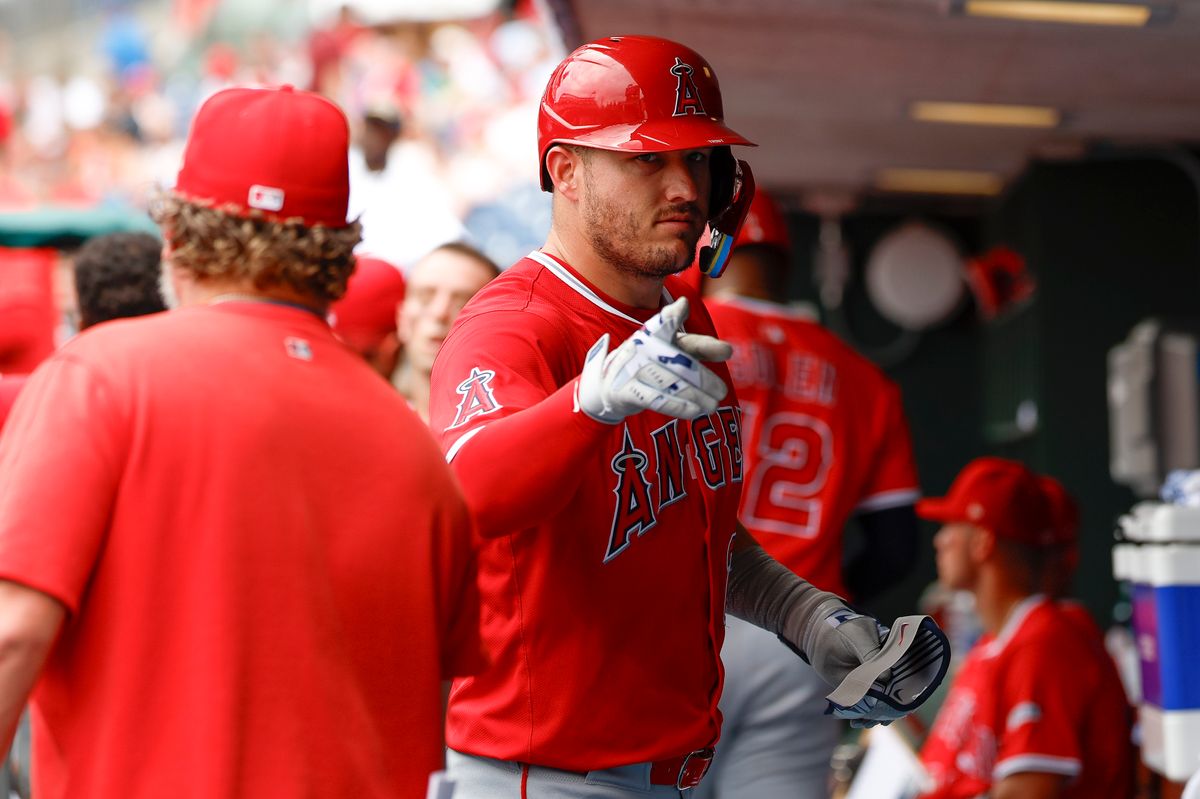 Mike Trout #27 of the Los Angeles Angels celebrates in the dugout during a game against the Philadelphia Phillies at Citizens Bank Park on July 19, 2025, in Philadelphia, Pennsylvania.