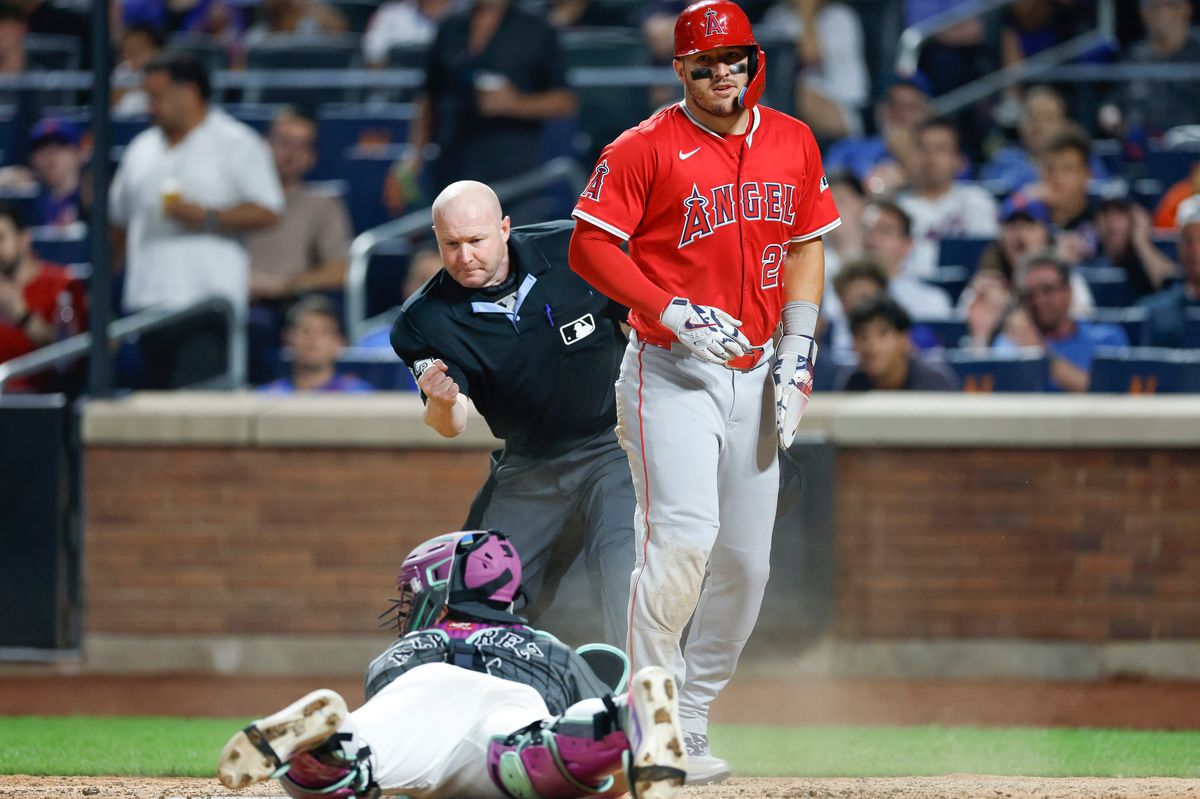 Mike Trout #27 of the Los Angeles Angels is tagged out at home plate against the New York Mets at Citi Field on July 21, 2025 in Flushing, NY.