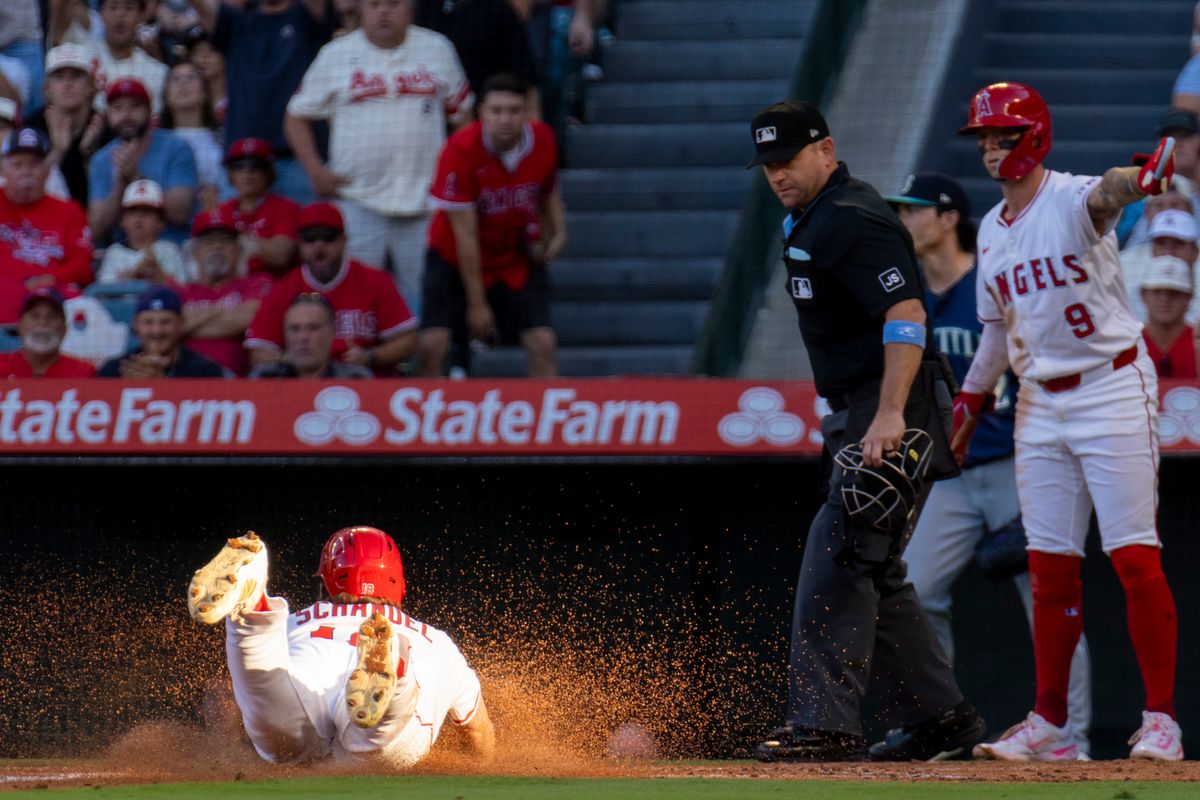 Los Angeles Angels infielder Nolan Schanuel (18) slides home and scores a run during the MLB game against the Seattle Mariners, Friday July 25th, 2025 in Anaheim, California. 