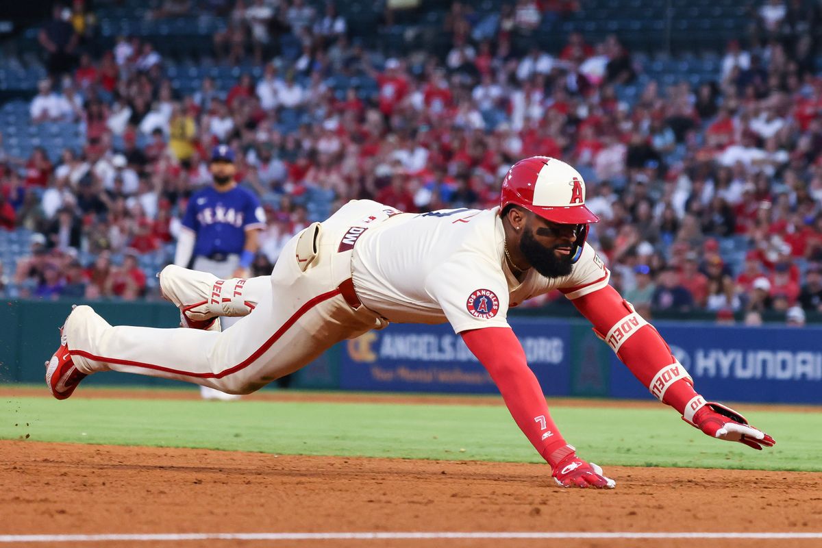 Los Angeles Angels outfielder Jo Adell (7) dives into third base during the MLB game against the Texas Rangers Tuesday July 29th, 2025 at Angel's Stadium in Anaheim, Calif.