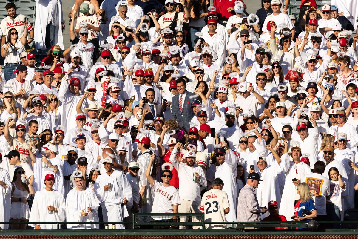 Los Angeles Angels Fans crowd the stands all wearing Halos and robes during the MLB game against the Texas Rangers Tuesday July 30th, 2025 at Angel's Stadium in Anaheim, Calif. Los Angeles Angels Fans crowd the stands all wearing Halos and robes during the MLB game against the Texas Rangers Tuesday July 30th, 2025 at Angel's Stadium in Anaheim, Calif.