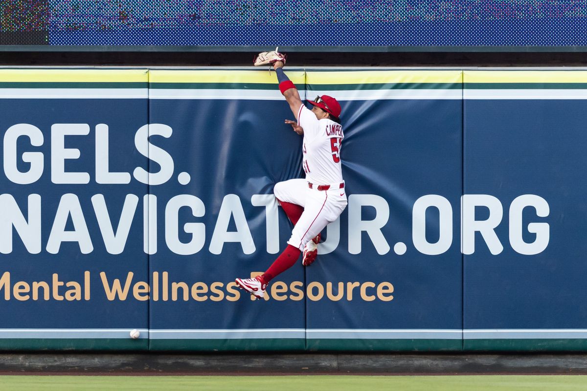 Los Angeles Angels outfielder Gustavo Campero (51) jumps the wall to catch a ball but misses during the MLB game against the Texas Rangers Tuesday July 30th, 2025 at Angel's Stadium in Anaheim, Calif. Los Angeles Angels outfielder Gustavo Campero (51) jumps the wall to catch a ball but misses during the MLB game against the Texas Rangers Tuesday July 30th, 2025 at Angel's Stadium in Anaheim, Calif.