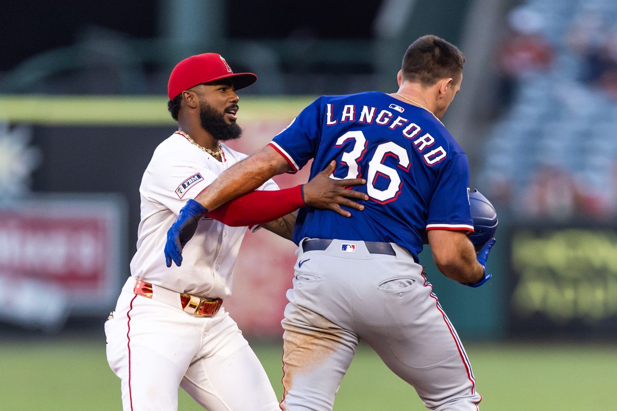 Los Angeles Angels third base Luis Rengifo (2) tags Texas Rangers outfielder Wyatt Langford (36) as he over-slides on second base during the MLB game against the Texas Rangers Tuesday July 30th, 2025 at Angel's Stadium in Anaheim, Calif. Los Angeles Angels third base Luis Rengifo (2) tags Texas Rangers outfielder Wyatt Langford (36) as he over-slides on second base during the MLB game against the Texas Rangers Tuesday July 30th, 2025 at Angel's Stadium in Anaheim, Calif.