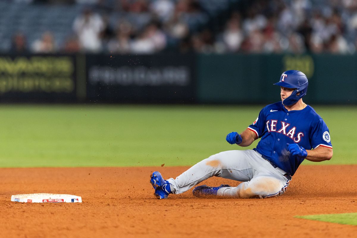 Texas Rangers player slides into second base during the MLB game against the Los Angeles Angels Tuesday July 30th, 2025 at Angel's Stadium in Anaheim, Calif. Texas Rangers player slides into second base during the MLB game against the Los Angeles Angels Tuesday July 30th, 2025 at Angel's Stadium in Anaheim, Calif.
