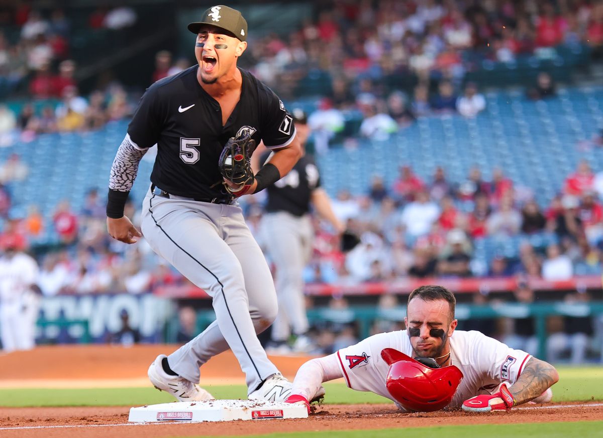 #5 Josh Rojas of the Chicago White Sox celebrates tagging out #9 Zach Neto of the Los Angeles Angels during an MLB game on August 1, 2025 in Anaheim, CA.
