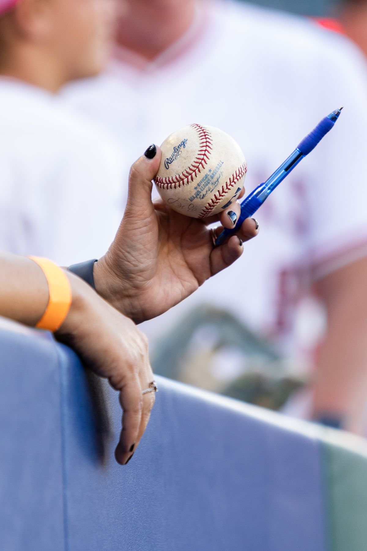 Los Angeles Angels fan holds out ball during the MLB game against the Chicago White Sox, Saturday, August 2nd 2025 at Angel's Stadium in Anaheim, Calif.