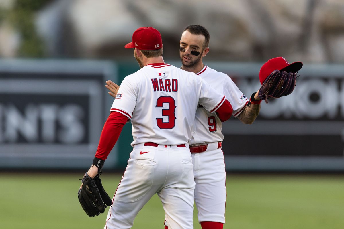 Los Angeles Angels outfielder Taylor Ward (3) hands Los Angeles Angels shortstop Zach Neto (9) his hat back during the MLB game against the Chicago White Sox, Saturday, August 2nd 2025 at Angel's Stadium in Anaheim, Calif.