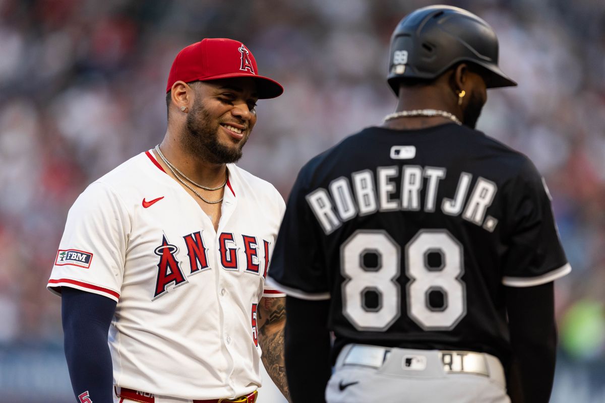 Los Angeles Angels third base Yoán Moncada (5) talks with Chicago White Sox outfielder Luis Robert Jr. (88) during the MLB game against the Chicago White Sox, Saturday, August 2nd 2025 at Angel's Stadium in Anaheim, Calif.