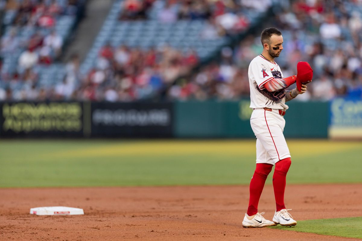 Los Angeles Angels shortstop Zach Neto (9) taks his hat off during the MLB game against the Chicago White Sox, Saturday, August 2nd 2025 at Angel's Stadium in Anaheim, Calif.