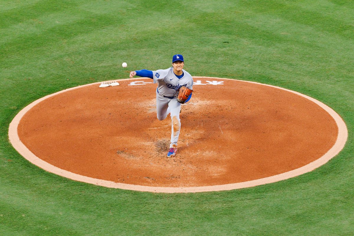 Shohei Ohtani #17 of the Los Angeles Dodgers pitches during the game against the Los Angeles Angels at Angel Stadium of Anaheim on August 13, 2025 in Anaheim, California.