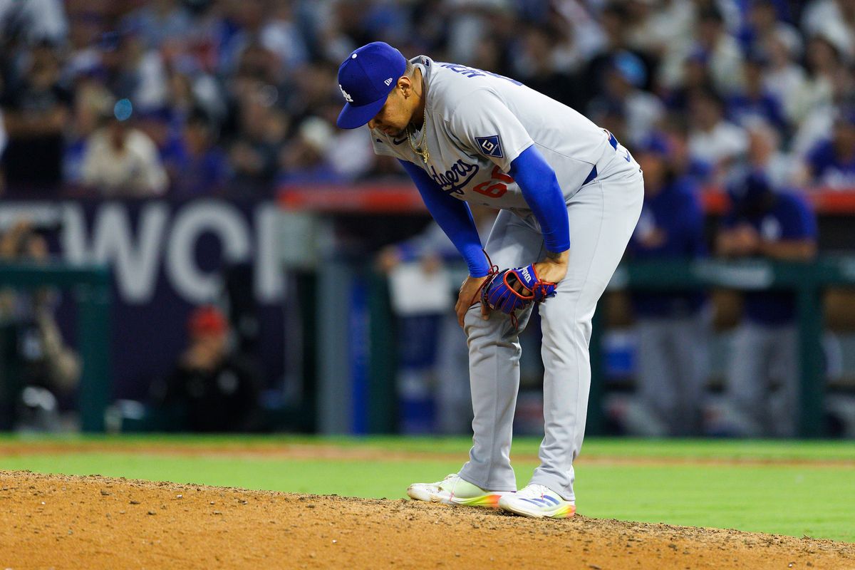 Edgardo Henriquez #60 of the Los Angeles Dodgers reacts after giving up the go ahead run during the game against the Los Angeles Angels at Angel Stadium of Anaheim on August 13, 2025 in Anaheim, California. 