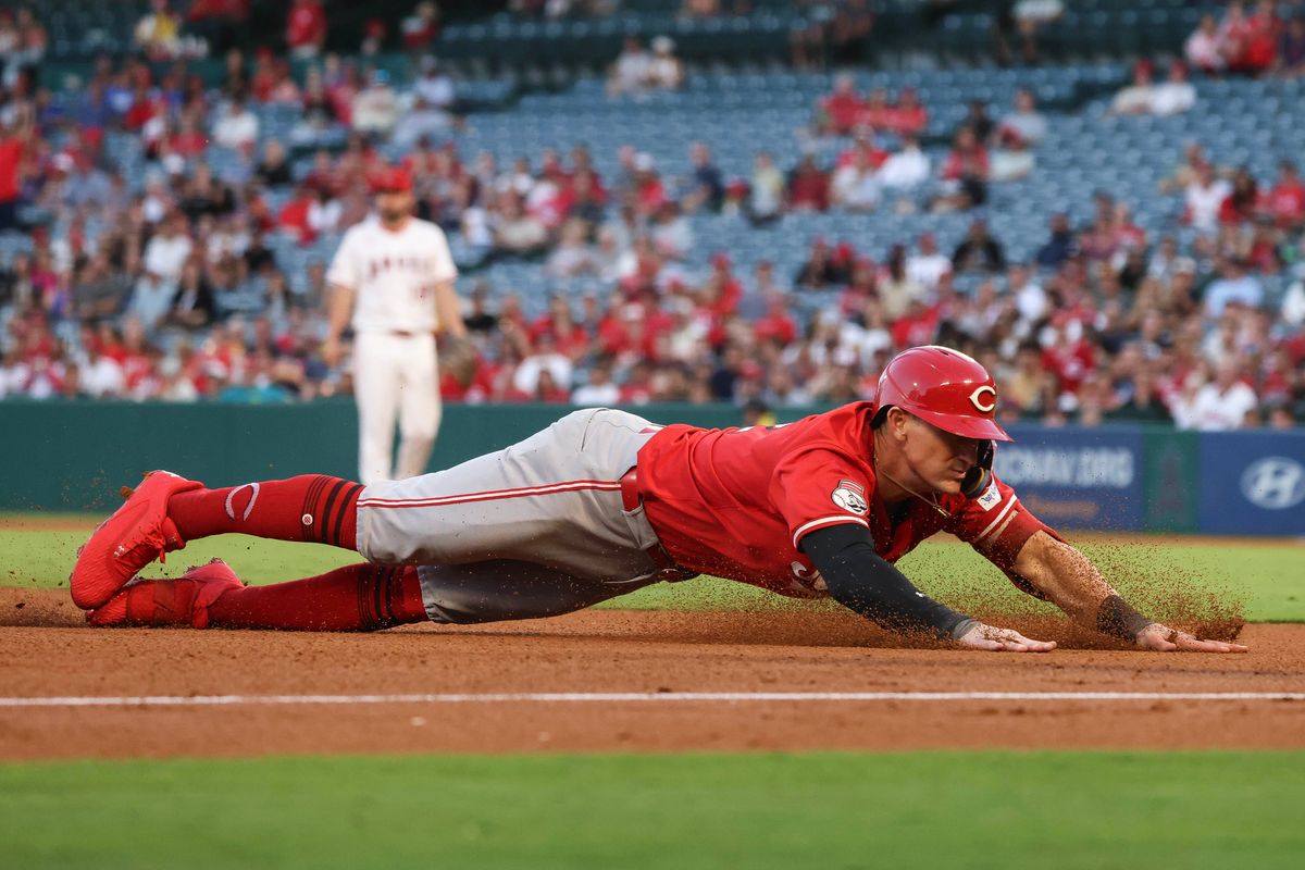 Cincinnati Reds outfielder Austin Hays (12) dives to third base during the MLB game against the Los Angeles Angels Monday August 18th, 2025 at Angel's Stadium in Anaheim, Calif.