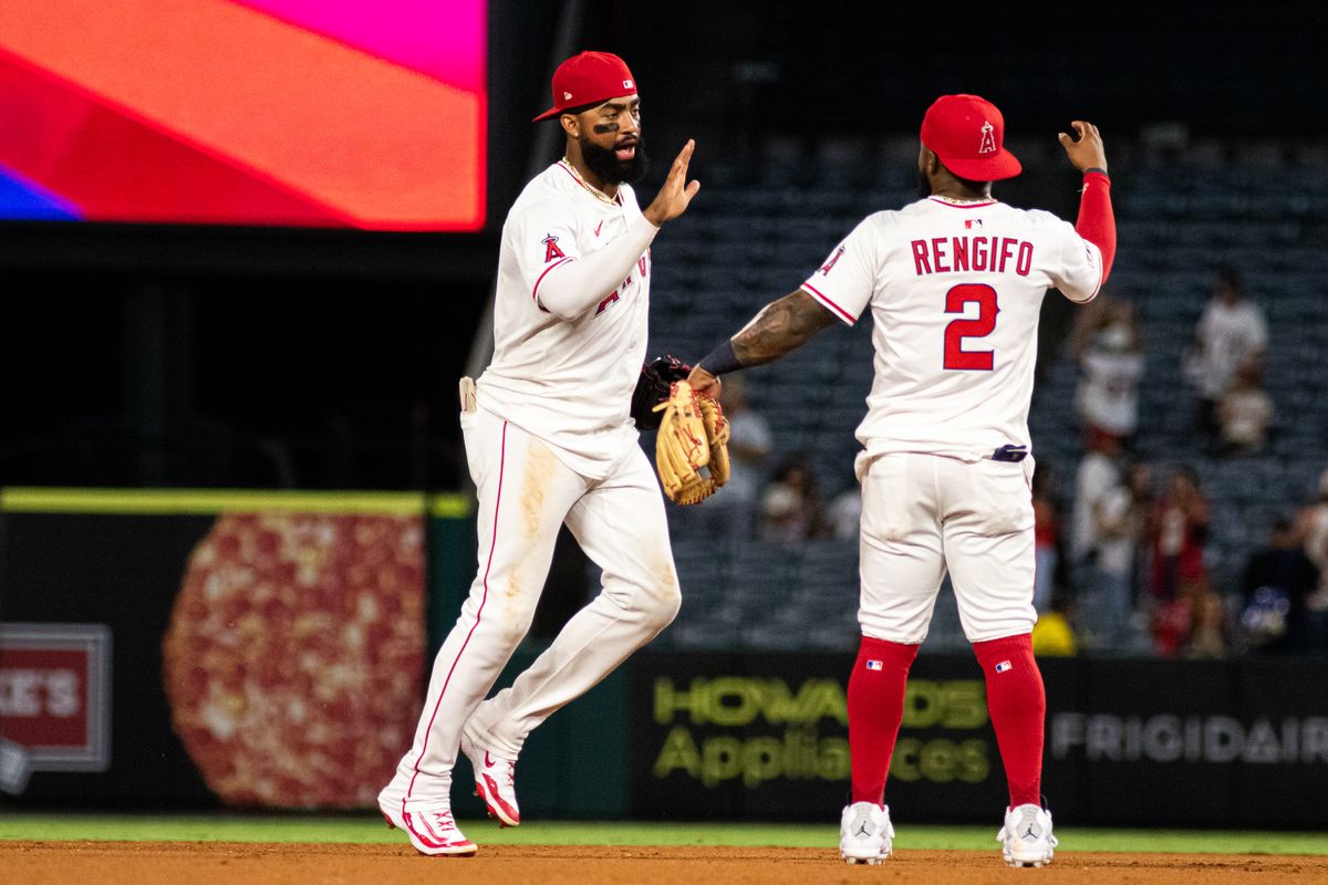 Los Angeles Angels Infielder Luis Rengifo (2) and Outfielder Jo Adell (7) celebrate a victory Los Angeles Angels Right-Handed Pitcher Luis Garcia (66) delivers a pitch in the 9th inning in an MLB game against the Cincinnati Reds, Wednesday, August 20, 2025 at Angels Stadium in Anaheim, California.