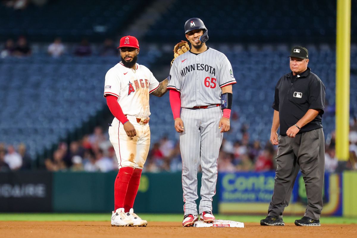 #2 Luis Rengifo of the Los Angeles Angels shares a laugh with #65 Jhonny Pereda of the Minnesota Twins during an MLB game on Tuesday September 9, 2025 in Anaheim, CA. #2 Luis Rengifo of the Los Angeles Angels shares a laugh with #65 Jhonny Pereda of the Minnesota Twins during an MLB game on Tuesday September 9, 2025 in Anaheim, CA.