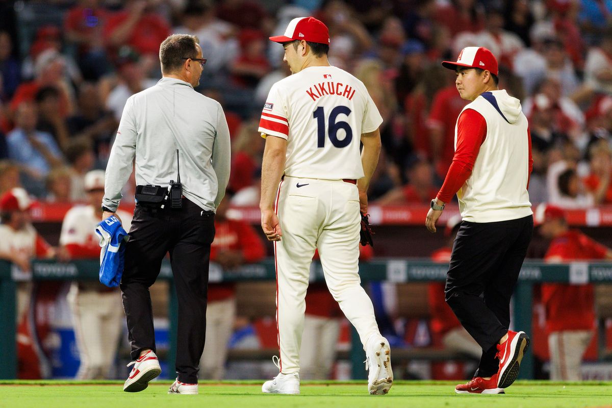 Yusei Kikuchi #16 of the Los Angeles Angels walks off the field with trainers during the game against the Kansas City Royals at Angel Stadium of Anaheim on September 24, 2025 in Anaheim, California. Yusei Kikuchi #16 of the Los Angeles Angels walks off the field with trainers during the game against the Kansas City Royals at Angel Stadium of Anaheim on September 24, 2025 in Anaheim, California.