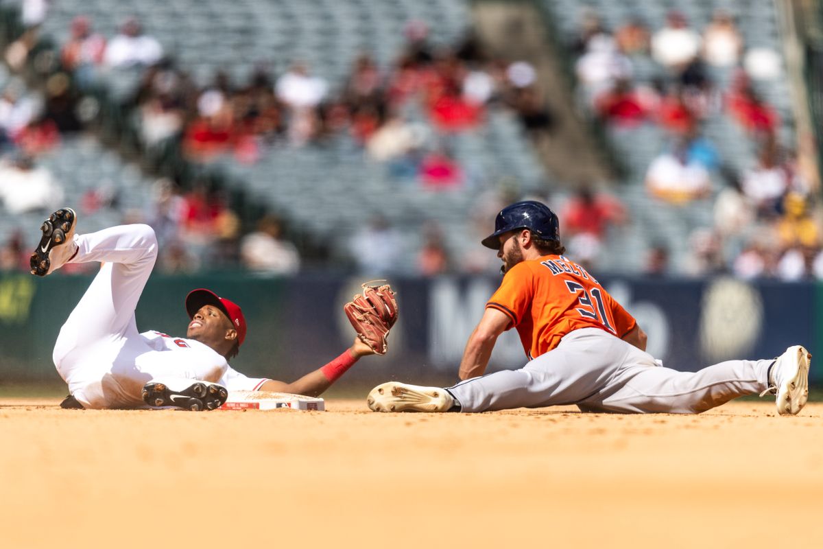 Los Angeles Angels shortstop Denzer Guzman (13) tags out incoming runner from 1st base during the MLB game against the Houston Astros on Sunday, September 28, 2025, at Angel Stadium in Anaheim, Calif.