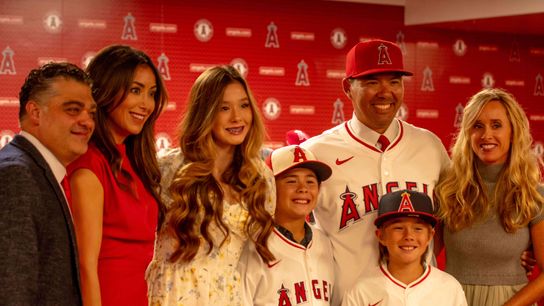 Kurt Suzuki with his family at his introductory press conference as the Los Angeles Angels Manager. Kurt Suzuki with his family at his introductory press conference as the Los Angeles Angels Manager.
