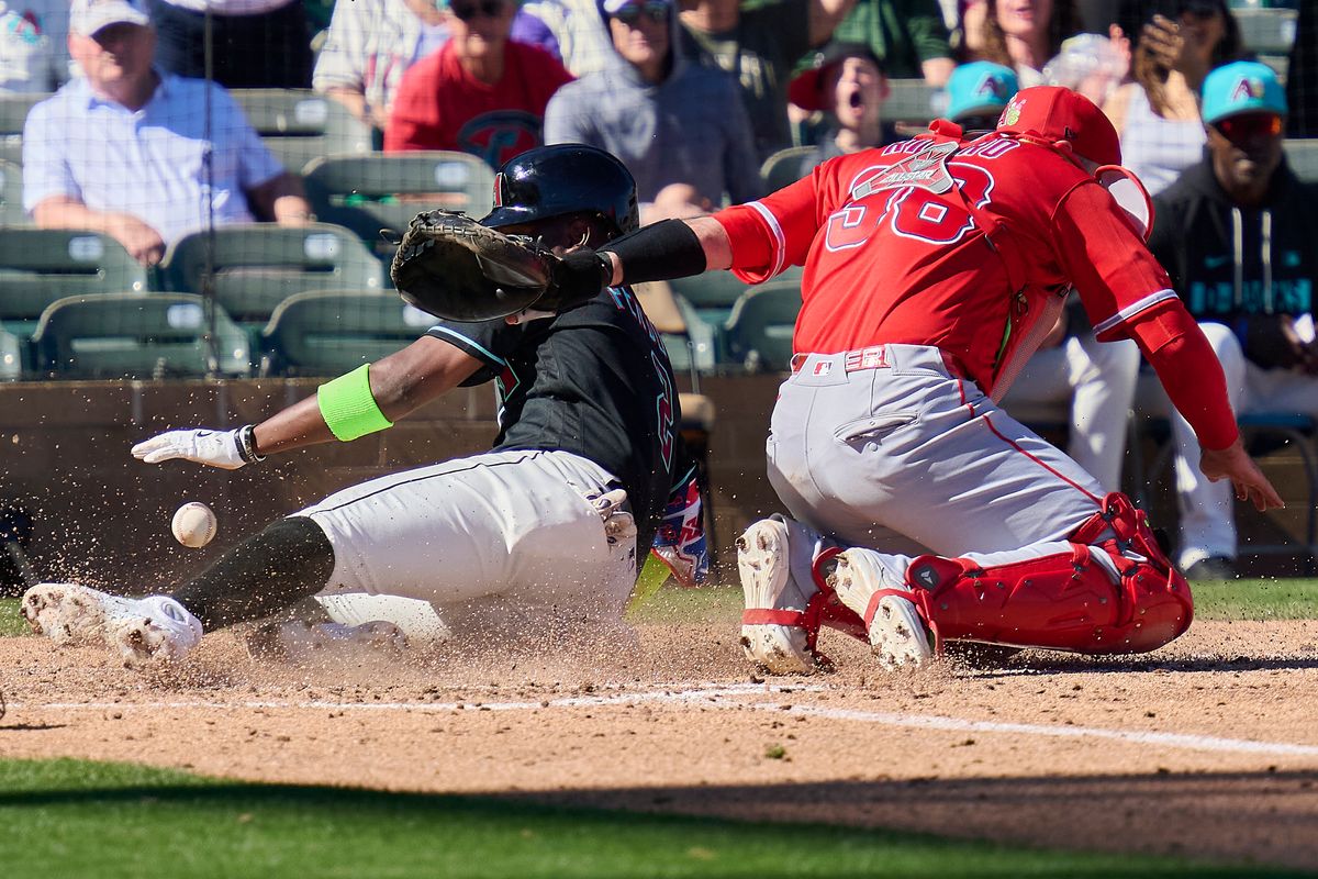 The Los Angeles Angels catcher Sebastián Rivero (38) attempts an out at home against The Arizona Diamondbacks ,February 22nd, 2026 in Scottsdale Arizona. The Los Angeles Angels catcher Sebastián Rivero (38) attempts an out at home against The Arizona Diamondbacks ,February 22nd, 2026 in Scottsdale Arizona.