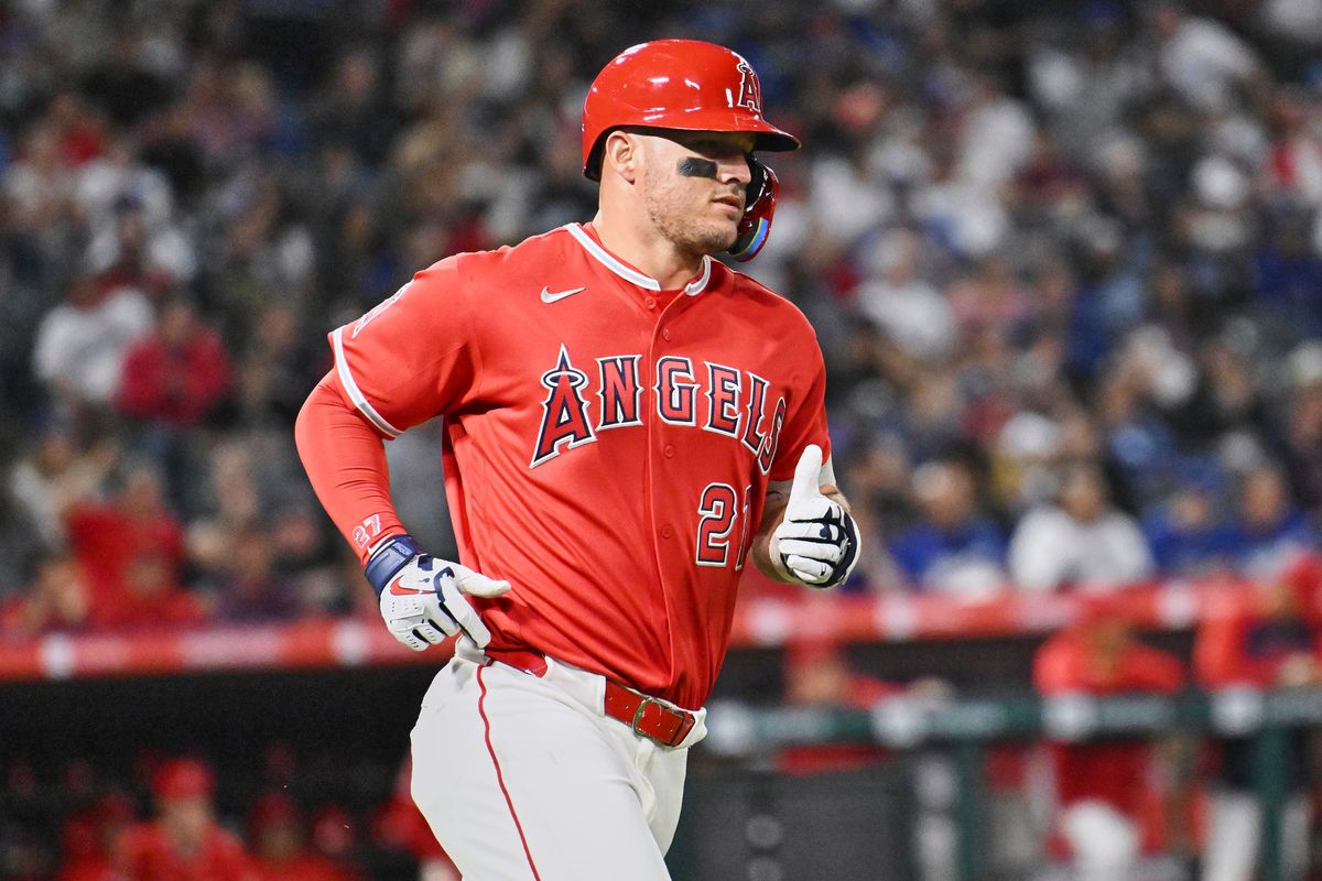 The Los Angeles Angels center fielder Mike Trout (27) hits a single during a Spring Training Game against The Los Angeles Dodgers, March 22nd, 2026 in Anaheim, California.