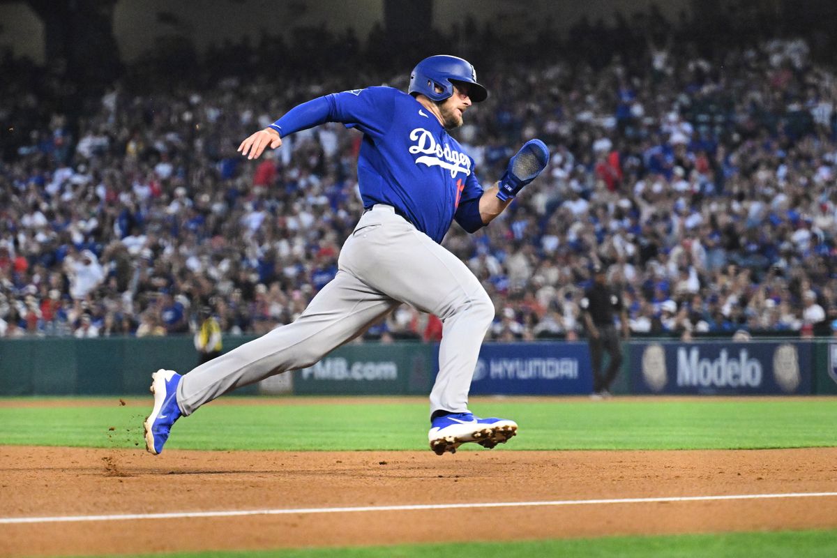 The Los Angeles Dodgers third baseman Max Muncy (13) rounds third during a Spring Training Game against The Los Angeles Angels, March 22nd, 2026 in Anaheim, California.