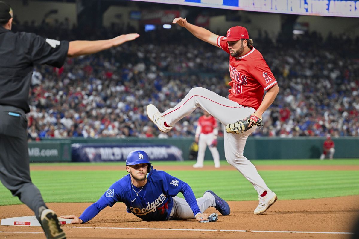 The Los Angeles Angels first baseman Nolan Schanuel (18) attempts a tag during a Spring Training Game against The Los Angeles Dodgers, March 22nd, 2026 in Anaheim, California.