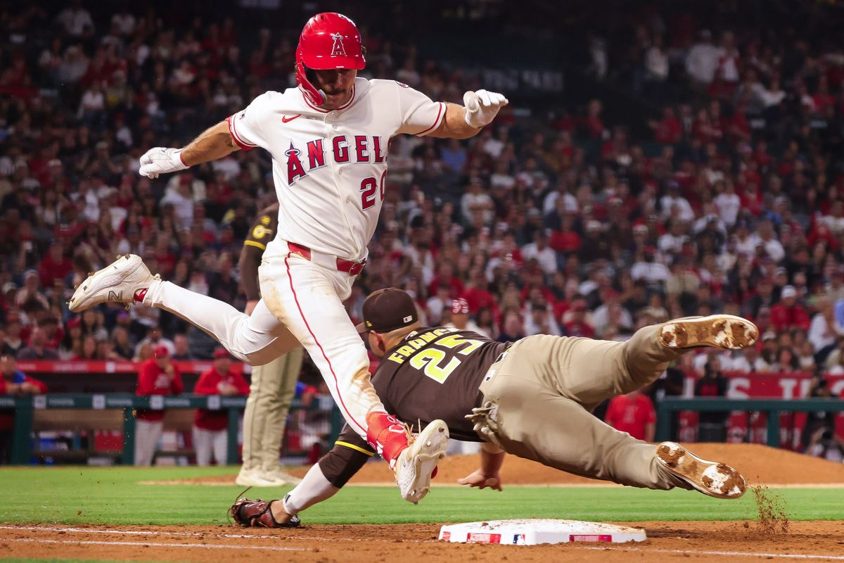 Los Angeles Angels infielder Adam Frazier (20) leaps to first base during the MLB game against the San Diego Padres Friday April 17th, 2026 at Angel's Stadium in Anaheim, Calif.