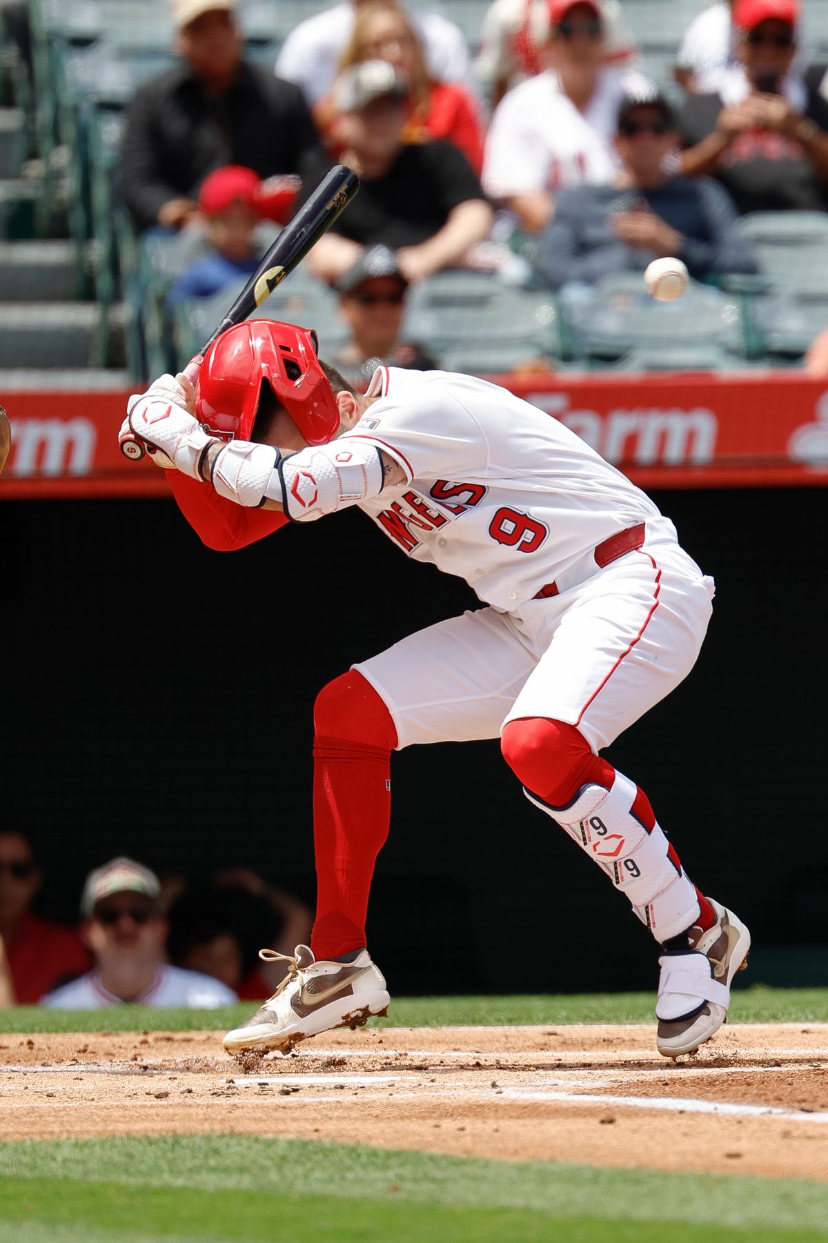 Zach Neto #9 of the Los Angeles Angels reacts to an inside pitch against the New York Mets at Angel Stadium on May 3, 2026, in Anaheim, California.
