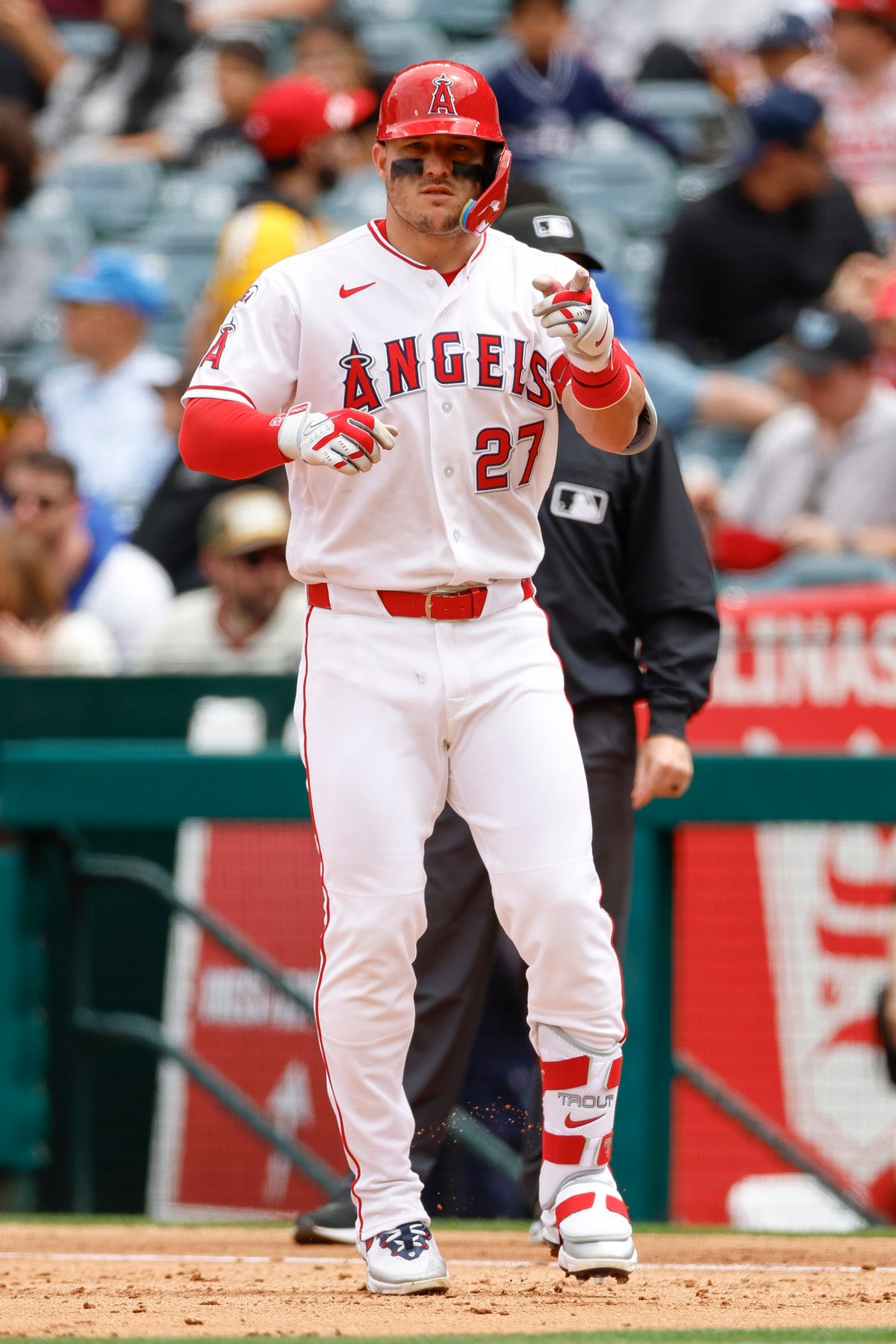 Mike Trout #27 of the Los Angeles Angels celebrates after hitting a single against the New York Mets at Angel Stadium on May 3, 2026, in Anaheim, California.