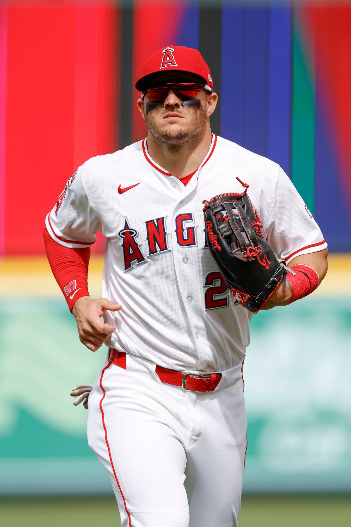 Mike Trout #27 of the Los Angeles Angels jogs to the dugout against the New York Mets at Angel Stadium on May 3, 2026, in Anaheim, California.