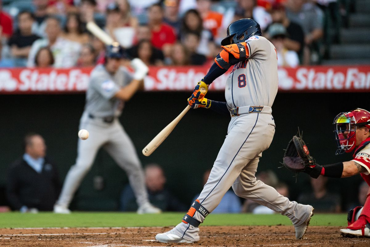 Houston Astros 1st baseman Christian Walker (8) swings and makes contact during a game between the Houston Astros and the Los Angeles Angels on Monday, July 27, 2026 at Angels Stadium in Anaheim Calif.