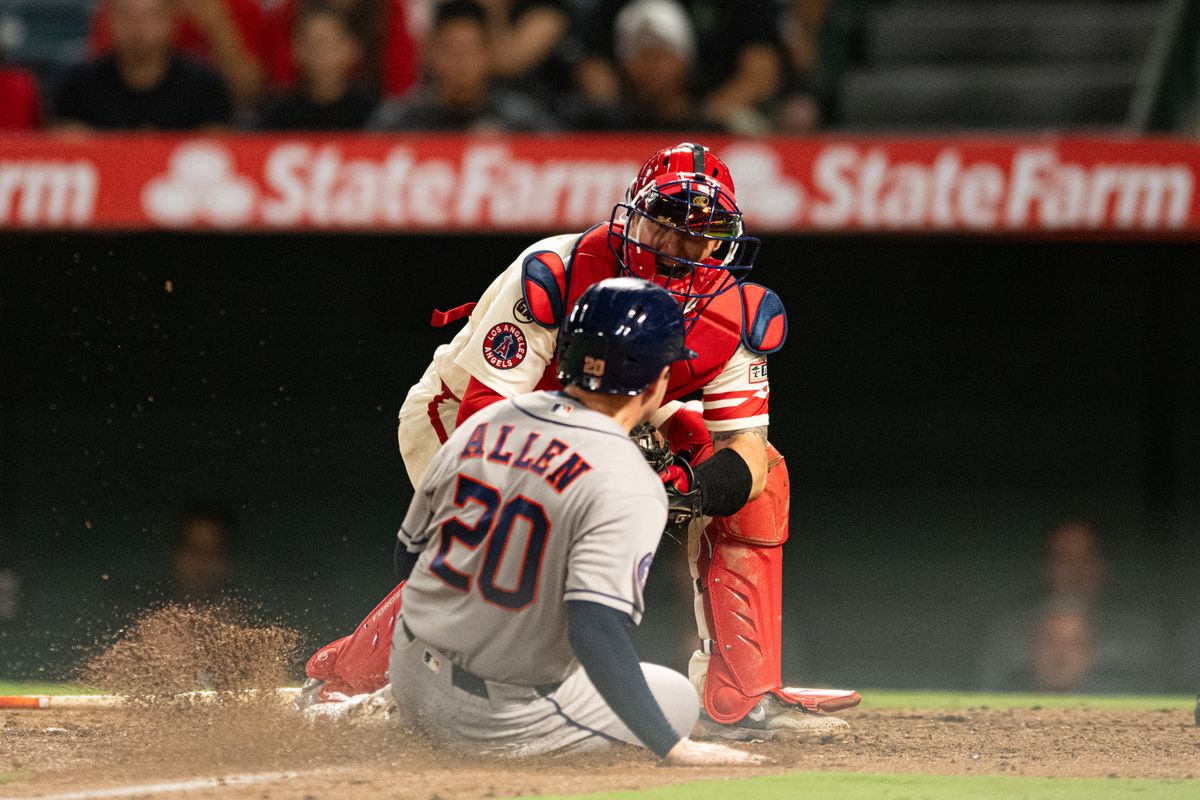 Houston Astros short stop Nick Allen (20) is tagged out at home plate during a game between the Houston Astros and the Los Angeles Angels on Monday, July 27, 2026 at Angels Stadium in Anaheim Calif.