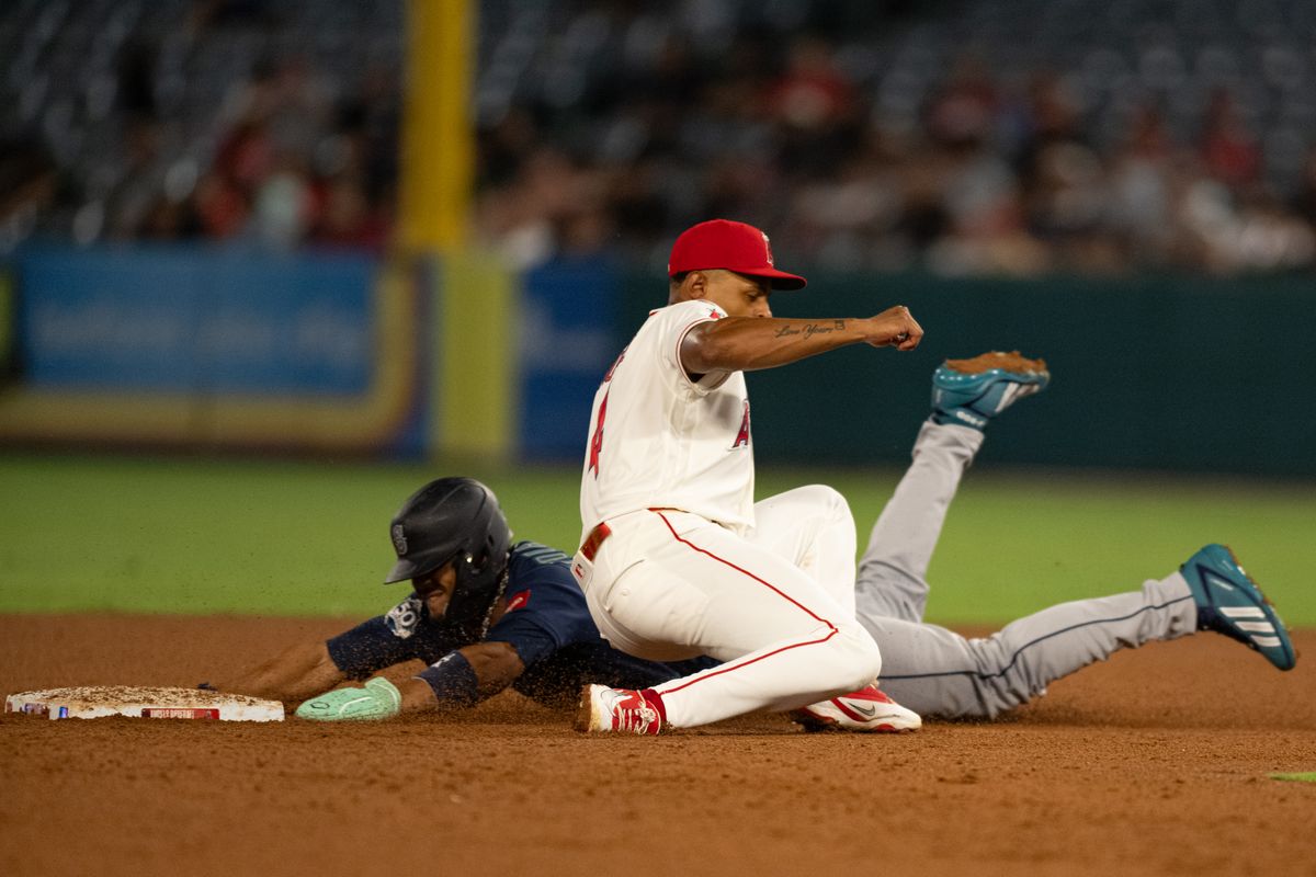 Los Angeles Angels second baseman Christian Moore (4) tags Seattle Mariners outfielder Julio Rodríguez (44) during an MLB match between Seattle Mariners and Los Angeles Angels on Monday, September 14, 2026 at Angel Stadium in Anaheim, California. Los Angeles Angels second baseman Christian Moore (4) tags Seattle Mariners outfielder Julio Rodríguez (44) during an MLB match between Seattle Mariners and Los Angeles Angels on Monday, September 14, 2026 at Angel Stadium in Anaheim, California.