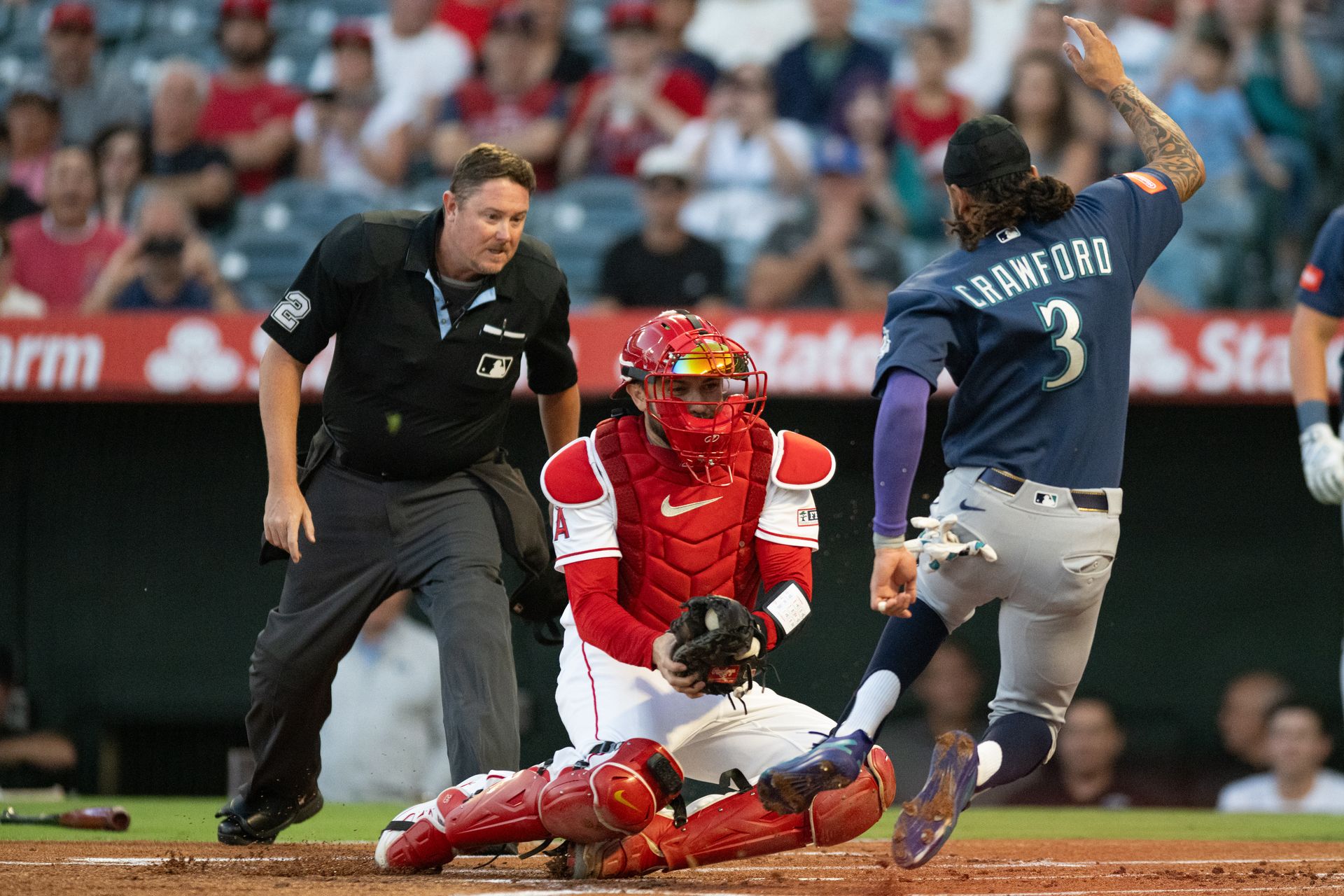 Seattle Mariners short stop J.P. Crawford (3) slides home and is tagged out during an MLB match between Seattle Mariners and Los Angeles Angels on Monday, September 14, 2026 at Angel Stadium in Anaheim, California. Seattle Mariners short stop J.P. Crawford (3) slides home and is tagged out during an MLB match between Seattle Mariners and Los Angeles Angels on Monday, September 14, 2026 at Angel Stadium in Anaheim, California.