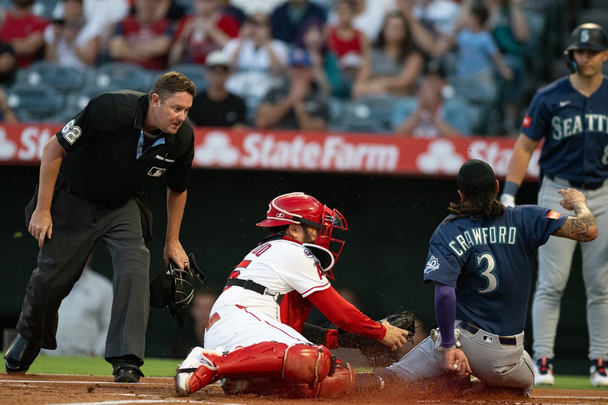 Seattle Mariners short stop J.P. Crawford (3) slides home and is tagged out during an MLB match between Seattle Mariners and Los Angeles Angels on Monday, September 14, 2026 at Angel Stadium in Anaheim, California. Seattle Mariners short stop J.P. Crawford (3) slides home and is tagged out during an MLB match between Seattle Mariners and Los Angeles Angels on Monday, September 14, 2026 at Angel Stadium in Anaheim, California.