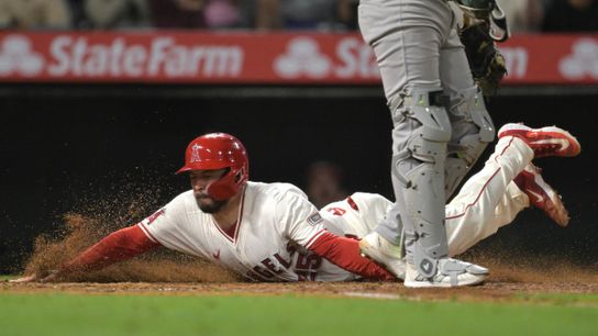 Jun 9, 2025; Anaheim, California, USA; Los Angeles Angels catcher Travis d'Arnaud (25) scores on a single by Los Angeles Angels center fielder Jo Adell (7) in the eighth inning against the Athletics at Angel Stadium. Mandatory Credit: Jayne Kamin-Oncea-Imagn Images Jun 9, 2025; Anaheim, California, USA; Los Angeles Angels catcher Travis d'Arnaud (25) scores on a single by Los Angeles Angels center fielder Jo Adell (7) in the eighth inning against the Athletics at Angel Stadium. Mandatory Credit: Jayne Kamin-Oncea-Imagn Images